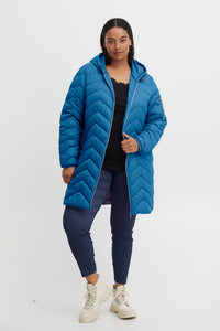 The Ines Curve Puffer Jacket in Bright Blue