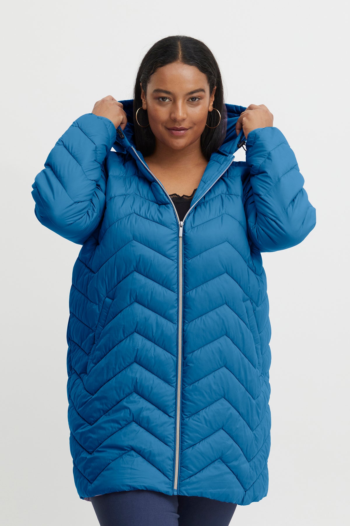 The Ines Curve Puffer Jacket in Bright Blue